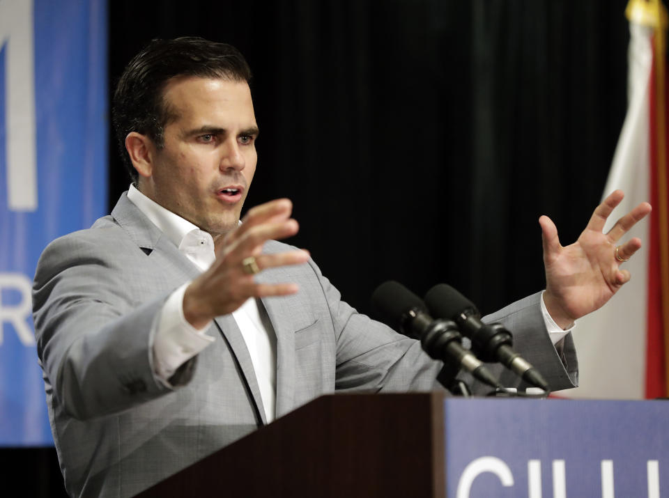 Puerto Rico Governor Ricardo Rossello endorses Florida Democratic gubernatorial candidate Andrew Gillum at a campaign rally Monday Oct. 1, 2018, in Kissimmee, Fla. (AP Photo/John Raoux)