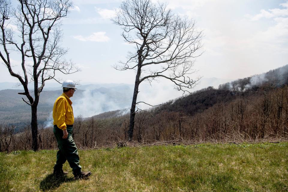 Robert Beanblossom looks out at the smoke from a fire along the Blue Ridge Parkway April 28, 2022.