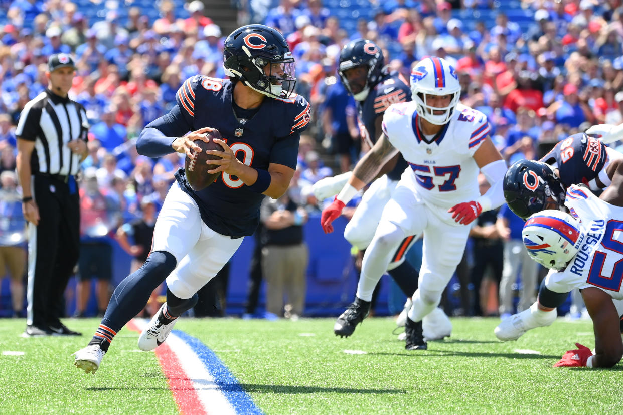 Caleb Williams, the No. 1 overall pick, runs it out of the pocket against the Bills. (Rich Barnes/Getty Images)