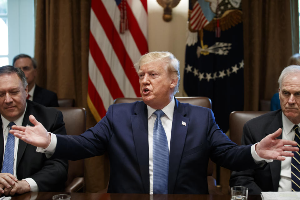 President Donald Trump speaks during a Cabinet meeting in the Cabinet Room of the White House, Tuesday, July 16, 2019, in Washington. Trump is accompanied by Secretary of State Mike Pompeo, left, and acting Defense Secretary Richard Spencer. (AP Photo/Alex Brandon)