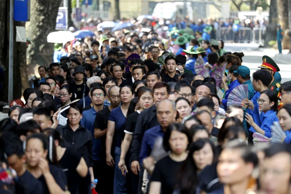 People line up to visit the national funeral house to pay respects to Vietnam's General Secretary of the Communist Party Nguyen Phu Trong in Hanoi, Vietnam, Friday, July 26, 2024. (AP Photo/Minh Hoang)