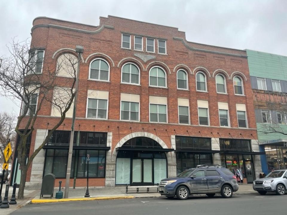 Kaylee and Maddie bought food at popular Grub Truck, which was parked outside this red brick building on Main Street in downtown Moscow (Sheila Flynn)