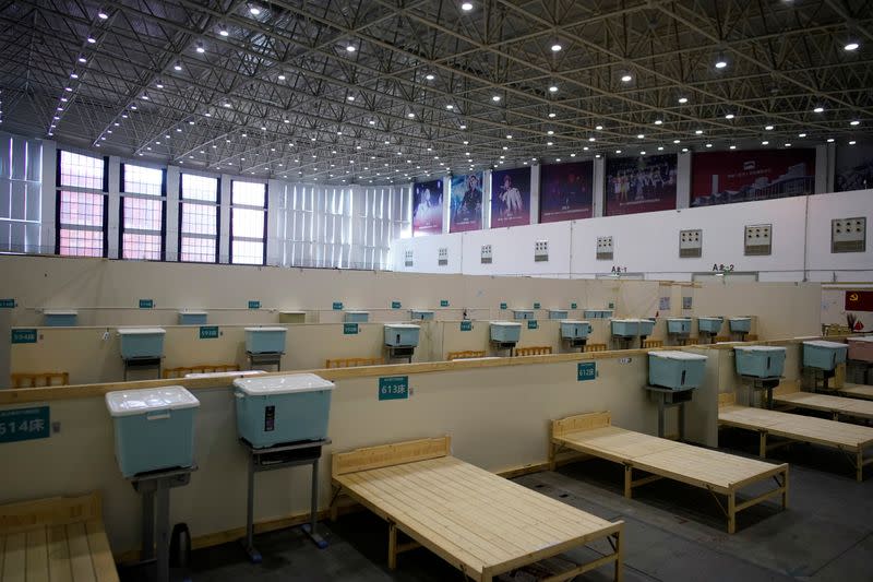 Bed frames are seen inside a convention center that was used as a makeshift hospital in Wuhan