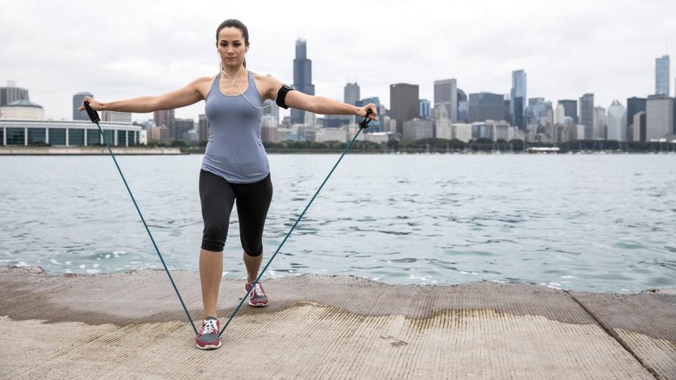 Resistance bands can help you tone muscle without acess to a gym. Image via Getty Images. 