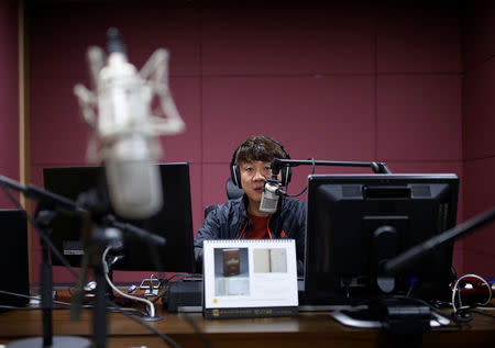 Kim Chung-seong, a North Korean defector and a Christian missionary, speaks during a radio broadcast at a radio station in Seoul, South Korea, April 21, 2016. REUTERS/Kim Hong-Ji