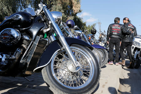 Members of the Iraq Bikers, the first Iraqi biker group, gather next to their motorbikes on a street of Baghdad, Iraq December 28, 2018. REUTERS/Thaier Al-Sudani