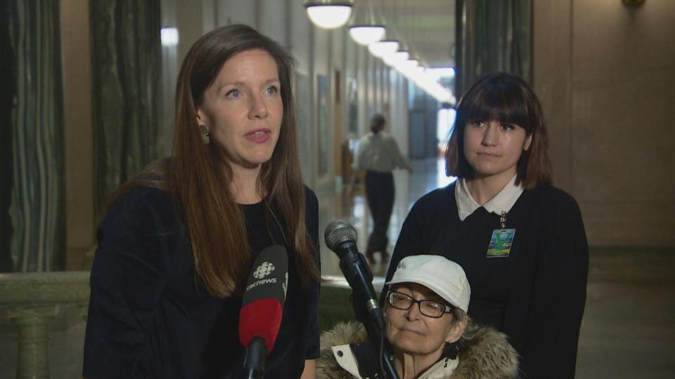 Oppostion NDP housing critic Meara Conway to reporters alongside Evylyn Harper at the Saskatchewan Legislative Building on Wednesday.