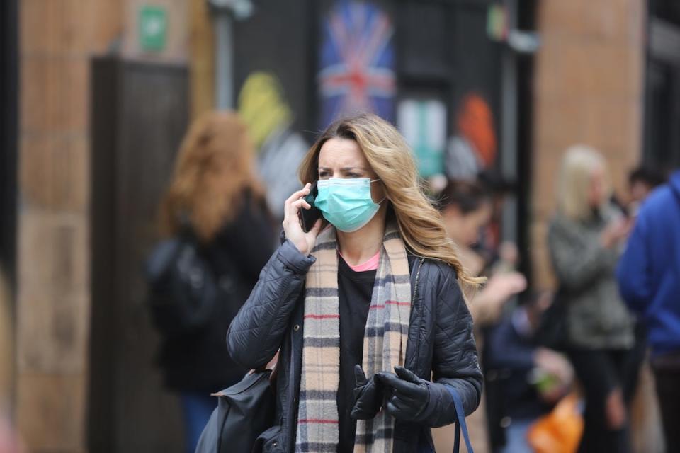 woman wears mask central london coronavirus