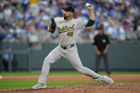 Oakland Athletics relief pitcher T.J. McFarland throws during the sixth inning of a baseball game against the Kansas City Royals Saturday, May 18, 2024, in Kansas City, Mo.(AP Photo/Charlie Riedel)
