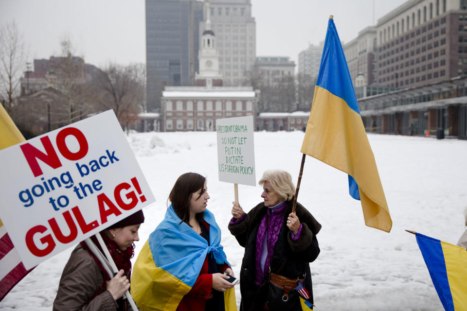 Members of the Ukrainian American communitie demonstrate in support Ukrainian anti-government protesters outside Independence Hall, Wednesday, Feb. 19, 2014, in Philadelphia. The violence on Tuesday was the worst in nearly three months of anti-government protests that have paralyzed Ukraine's capital, Kiev, in a struggle over the identity of a nation divided in loyalties between Russia and the West, and the worst in the country's post-Soviet history. (AP Photo/Matt Rourke)