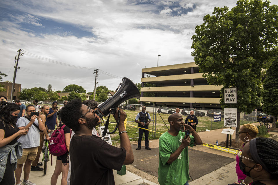 Tensions rise between protesters and police officers who were investigating a fatality in an officer involved shooting, Thursday, June 3, 2021 in Minneapolis. One person was killed Thursday when authorities who were part of a task force that included U.S. Marshals fired their weapons after the person displayed a handgun in Minneapolis' Uptown neighborhood, the U.S. Marshals said. (Richard Tsong-Taatarii/Star Tribune via AP)