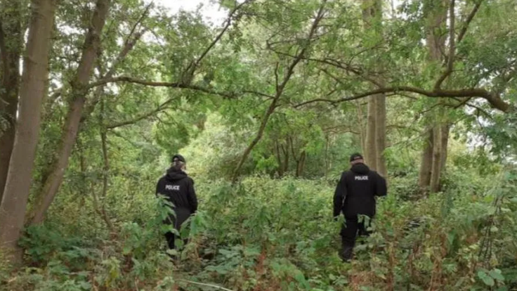 Police searching woodland following the disappearance of Liam Graham