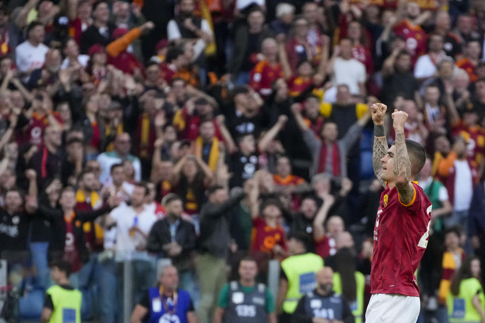 Roma's Gianluca Mancini celebrates after scoring his side's opening goal during a Serie A soccer match between Roma and Lazio, at Stadio Olimpico, in Rome, Italy, Saturday, April 6, 2024. (AP Photo/Gregorio Borgia)