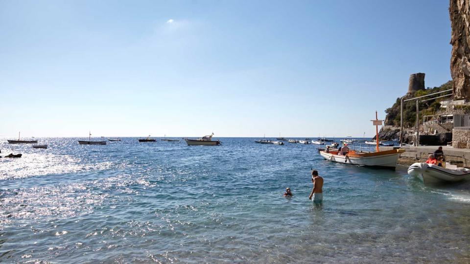 Splashing in the sea off the coast of Praiano, Italy