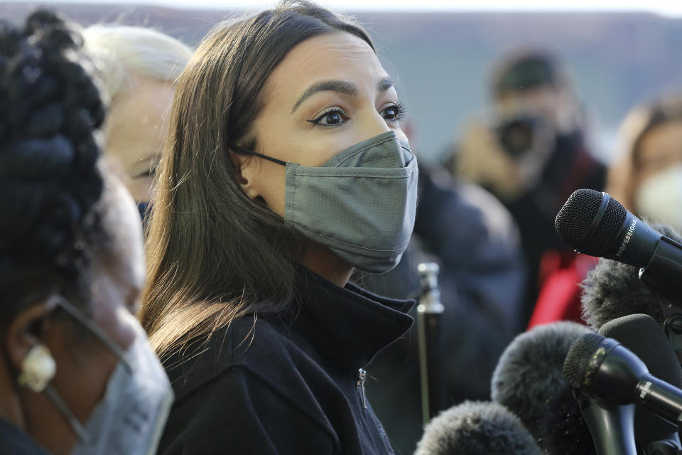 U.S. Rep. Alexandria Ocasio-Cortez talks to the media before volunteering at the Houston Food Bank on Saturday, Feb. 20, 2021. President Joe Biden declared a major disaster in Texas on Friday, directing federal agencies to help in the recovery. (Elizabeth Conley/Houston Chronicle via AP)