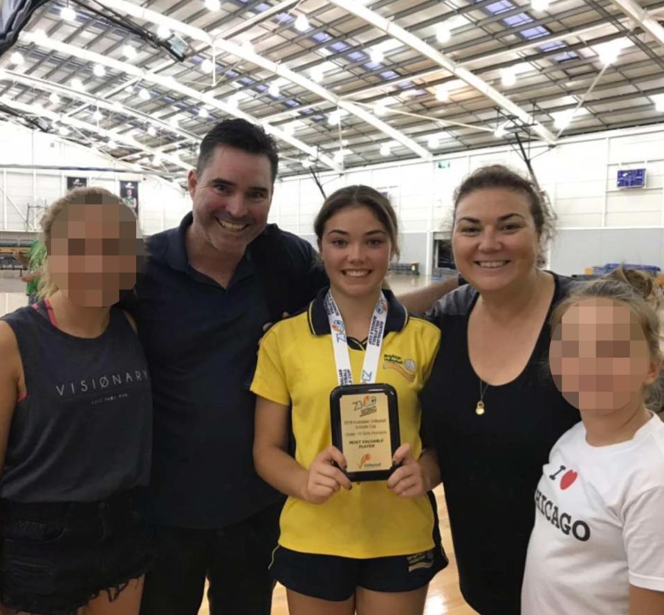 Sophia pictured with her parents, Luke Naismith and Pia Vogrin last year at a volleyball competition.