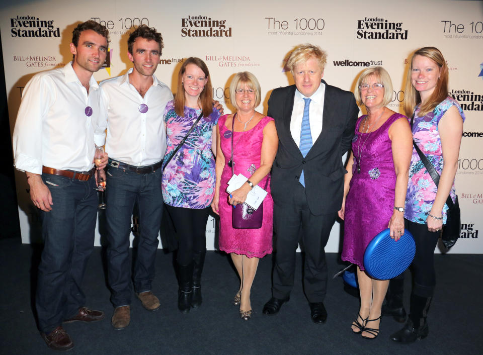 Mayor of London Boris Johnson with identical twins at the Evening Standard's The 1000 Most Influential Londoners 2014, event at The Francis Crick Institute in London.