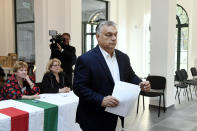 Hungarian Prime Minister Viktor Orban of the governing Fidesz party prepares to cast his ballot at the nationwide local elections in Budapest, Hungary, Sunday, Oct. 13, 2019. (Szilard Koszticsak/MTI via AP)