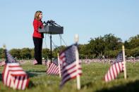 American flags representing 200,000 lives lost due to coronavirus are placed on National Mall in Washington