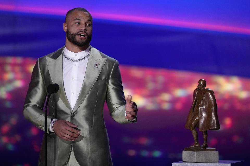 Walter Payton Player of the Year Award winner, Dallas Cowboys' Dak Prescott, speaks during the NFL Honors award show ahead of the Super Bowl 57 football game, Thursday, Feb. 9, 2023, in Phoenix. (AP Photo/David J. Phillip)