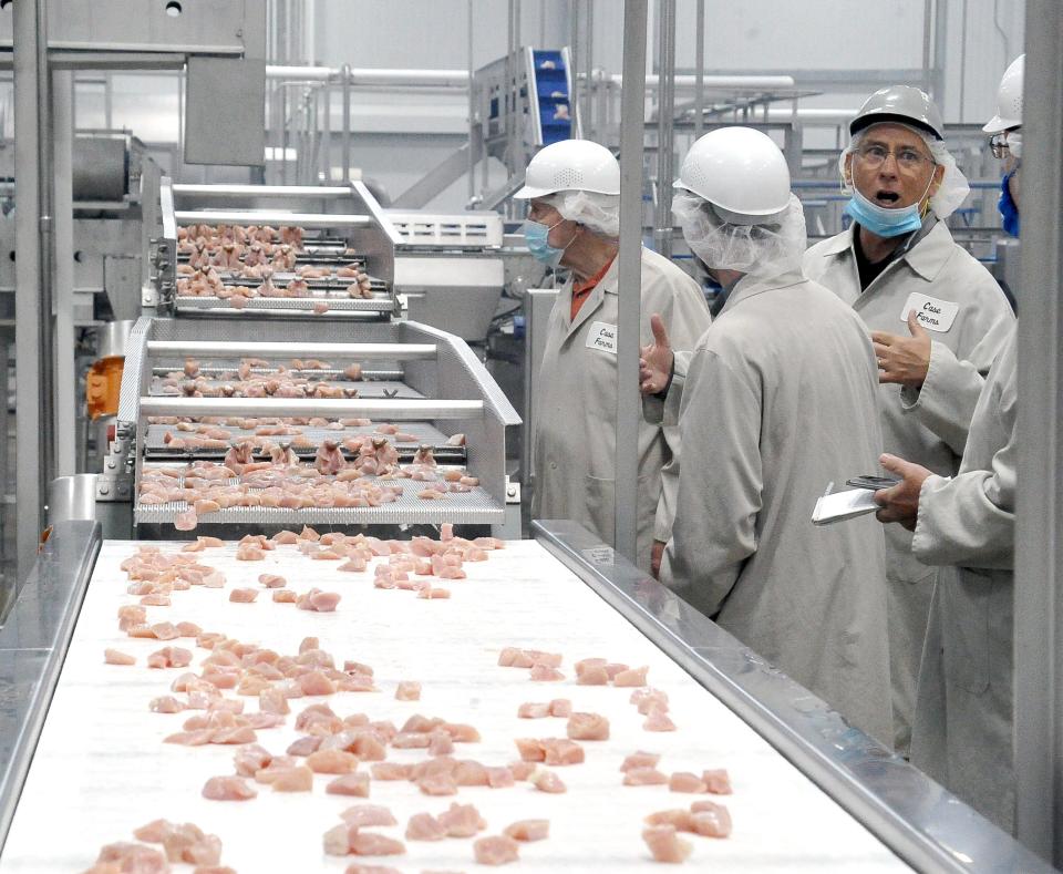 Case Farms, a poultry farming and processing group, hit a safety milestone on Sept. 21 when its Winesburg processing facility reached 1 million hours without a recorded lost-time accident. Workers process chicken nuggets in this file photo.