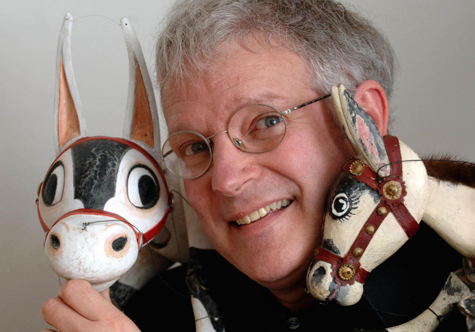 Puppeteer Ronnie Le Drew with the new Muffin the Mule puppet, left, and the original version of the puppet which was the first children's television character on the BBC 60 years ago.