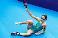 Erin Densham of Australia takes her shoes off after winning the bronze medal the Women's Triathlon on Day 8 of the London 2012 Olympic Games at Hyde Park on August 4, 2012 in London, England. (Getty Images)