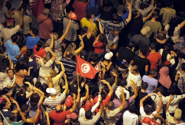 Tunisian protesters gather in front of the Constituent Assembly headquarters in Tunis on August 4, 2013