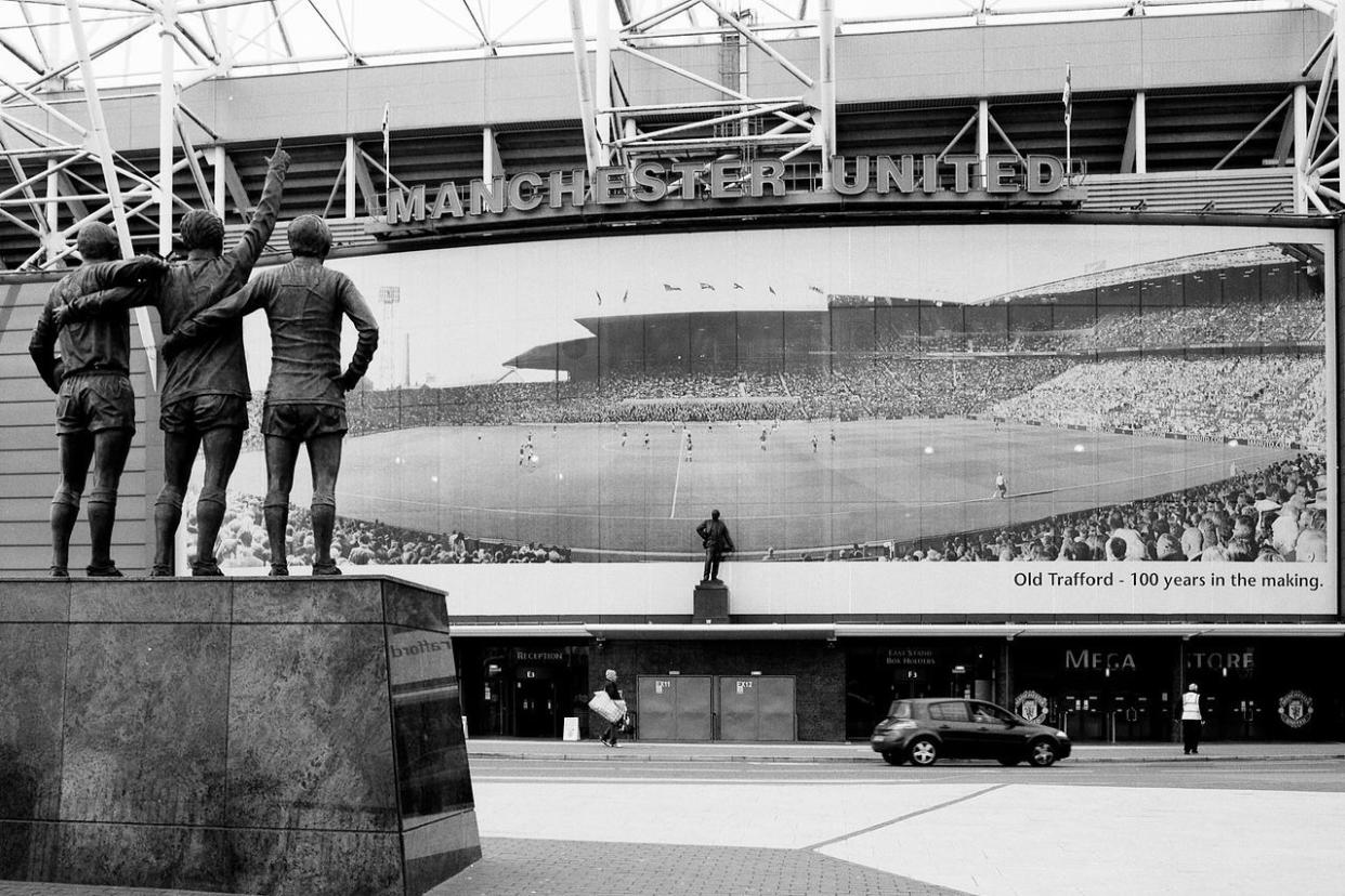 Old Trafford's East Stand in 2011, displaying a panorama of the stadium one hundred years prior.