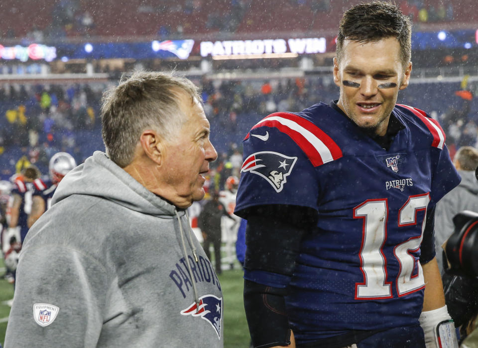 Oct 27, 2019; Foxborough, MA, USA; New England Patriots head coach Bill Belichick with quarterback Tom Brady (12) after defeating the Cleveland Browns at Gillette Stadium. Mandatory Credit: Greg M. Cooper-USA TODAY Sports