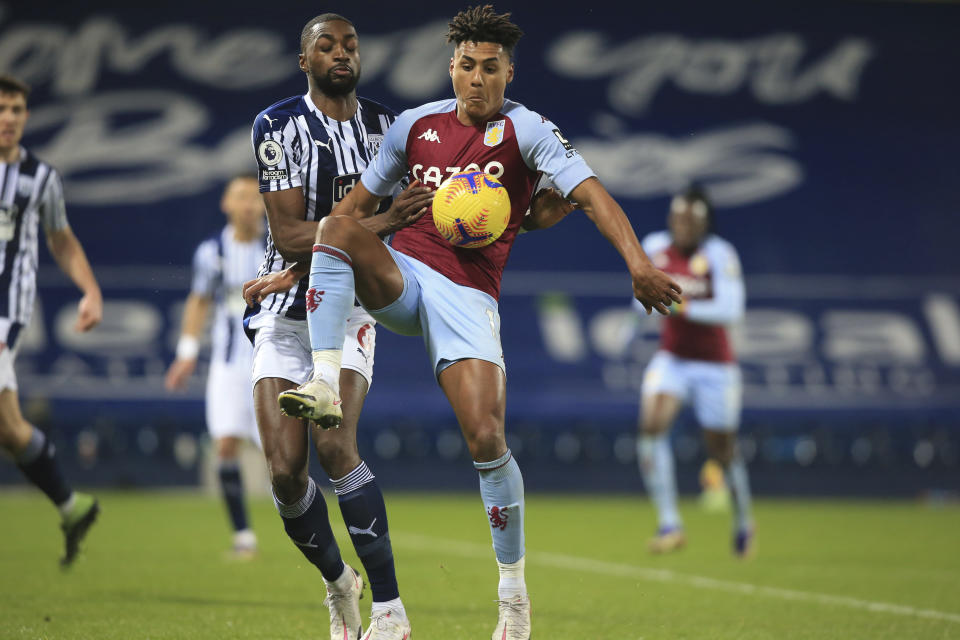 West Bromwich Albion's Semi Ajayi and Aston Villa's Ollie Watkins, center right, fight for the ball during the English Premier League soccer match between West Bromwich Albion and Aston Villa at the Hawthorns, West Bromwich, England, Sunday, Dec. 20, 2020. (Lindsey Parnaby/Pool via AP)