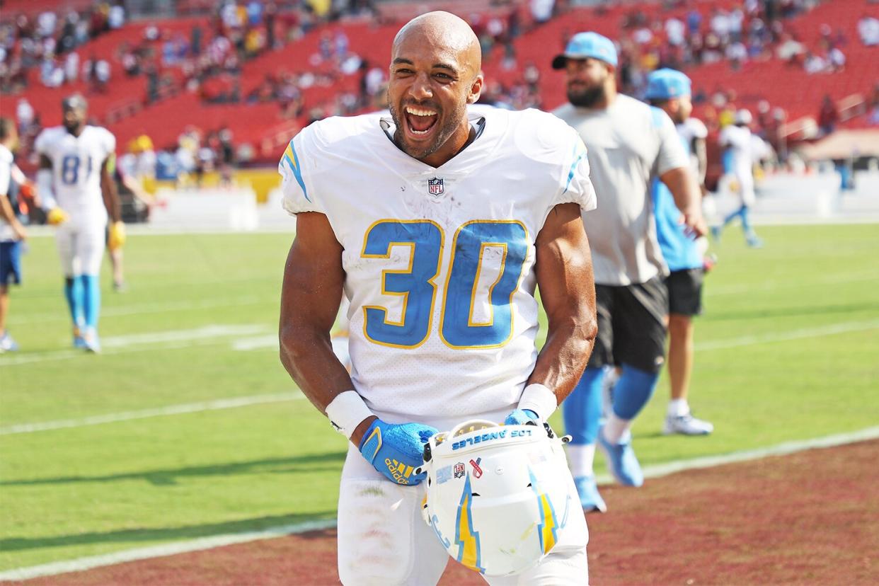 Austin Ekeler #30 of the Los Angeles Chargers celebrates after the game against the Washington Football Team at FedExField on September 12, 2021 in Landover, Maryland.