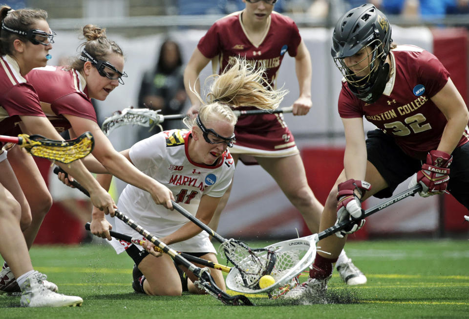 <p>Maryland’s Caroline Steele (11) competes for the ball with Boston College’s goalkeeper Zoe Ochoa (32) during the first half of the NCAA college Division 1 lacrosse championship final, Sunday, May 28, 2017, in Foxborough, Mass. (Photo: Elise Amendola/AP) </p>