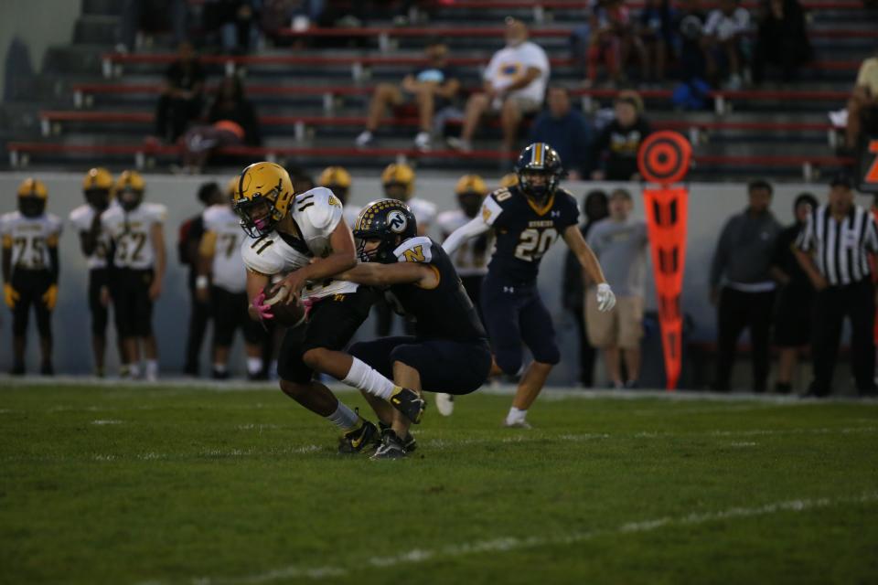 Port Huron Northern linebacker Danny Moore records a sack during a game earlier this season. He finished with 31 solo tackles and three sacks in 2022.