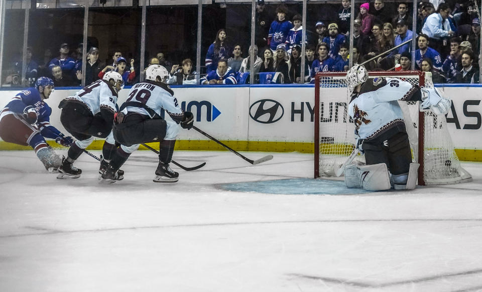 New York Rangers' Chris Kreider, left, watches his goal during an NHL hockey game against the Arizona Coyotes, Monday, Oct. 16, 2023, in New York. (AP Photo/Bebeto Matthews)