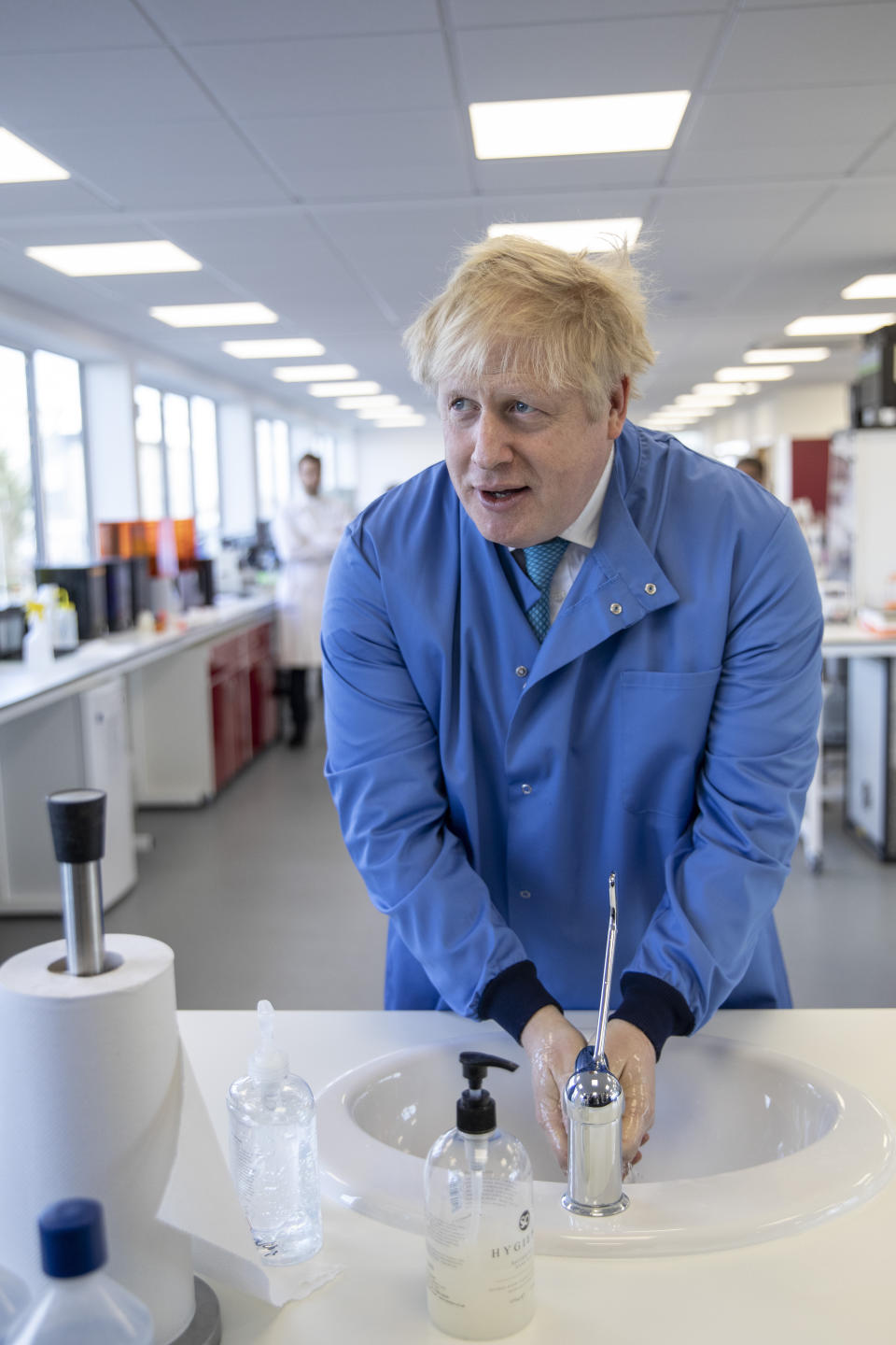 FILE - In this Friday March 6, 2020 file photo Britain's Prime Minister Boris Johnson washes his hands as he visits the Mologic Laboratory in the Bedford technology Park, England. Britain botched its response to the coronavirus the first time around. Now many scientists fear it’s about to do it again. The virus is on the rise again in the U.K., which has recorded almost 42,000 COVID-19 deaths, with confirmed infections at their highest level since May. (Jack Hill/Pool via AP, File)