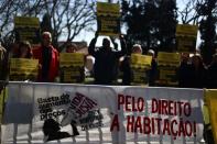 Protesters take part in a demonstration outside the goverment cabnet meeting that started the process for ruling on the housing crisis in Lisbon