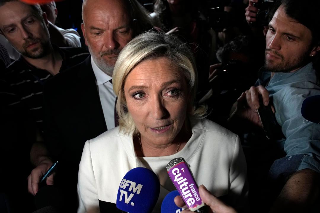 Far-right National Rally party leader Marine Le Pen answers reporters after the second round of the legislative election, Sunday, July 7, 2024 at the party election night headquarters in Paris. A coalition on the left that came together unexpectedly ahead of France's snap elections won the most parliamentary seats in the vote, according to polling projections Sunday. The surprise projections put President Emmanuel Macron's centrist alliance in second and the far right in third. (AP Photo/Louise Delmotte)