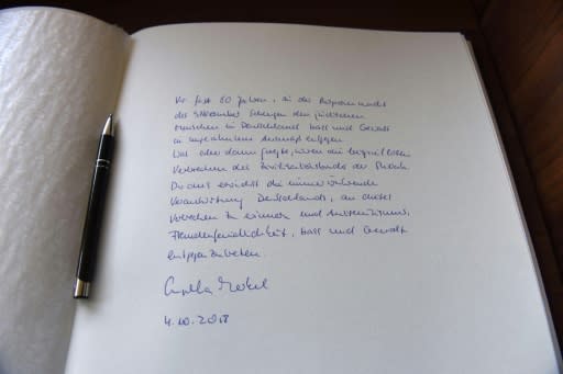 A close-up of the message Chancellor Angela Merkel wrote in the guest book of the Yad Vashem Holocaust Museum referring to the "everlasting everlasting responsibility of Germany to remember this crime and to oppose anti-Semitism"