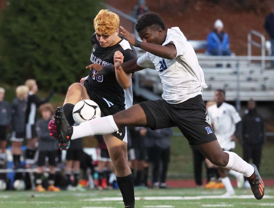 Randolph's Jonas Norsica kicks the soccer ball past Blackstone Valley Tech's Mason Baldini during a game on Wednesday, Nov. 16, 2022.  