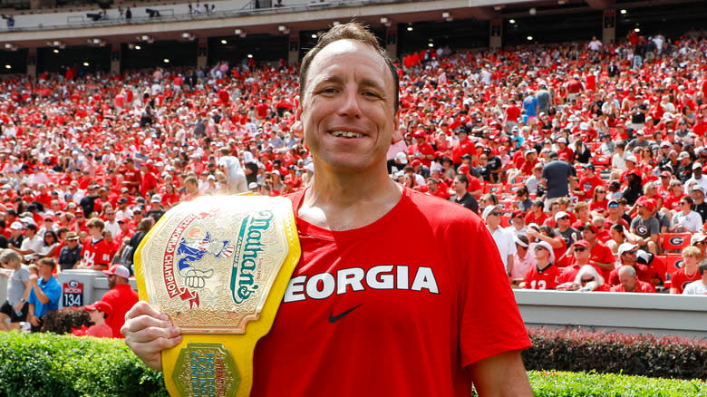 Joey Chestnut with a trophy