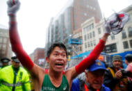 Yuki Kawauchi of Japan celebrates after winning the men's division of the 122nd Boston Marathon in Boston, Massachusetts, U.S., April 16, 2018. REUTERS/Brian Snyder