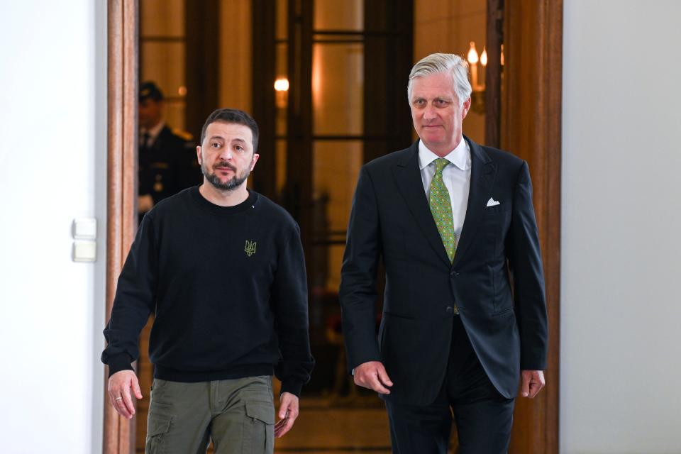 Belgium's King Philippe, right, walks with Ukraine's President Volodymyr Zelensky prior to a meeting at the Royal Palace in Brussels (AP)