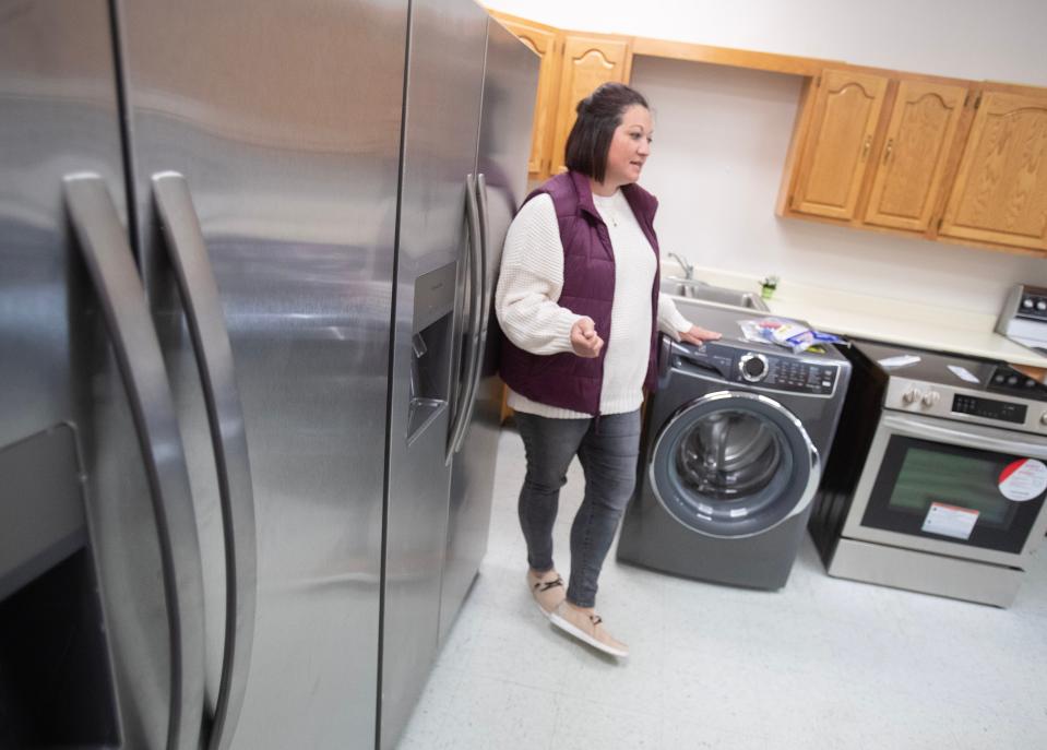 Abby Honaker Schroeder,Director of the Regula Center for Public Service and Engagement talks about the life skills classroom that also serves as a break room for volunteers at the Alliance Commons.