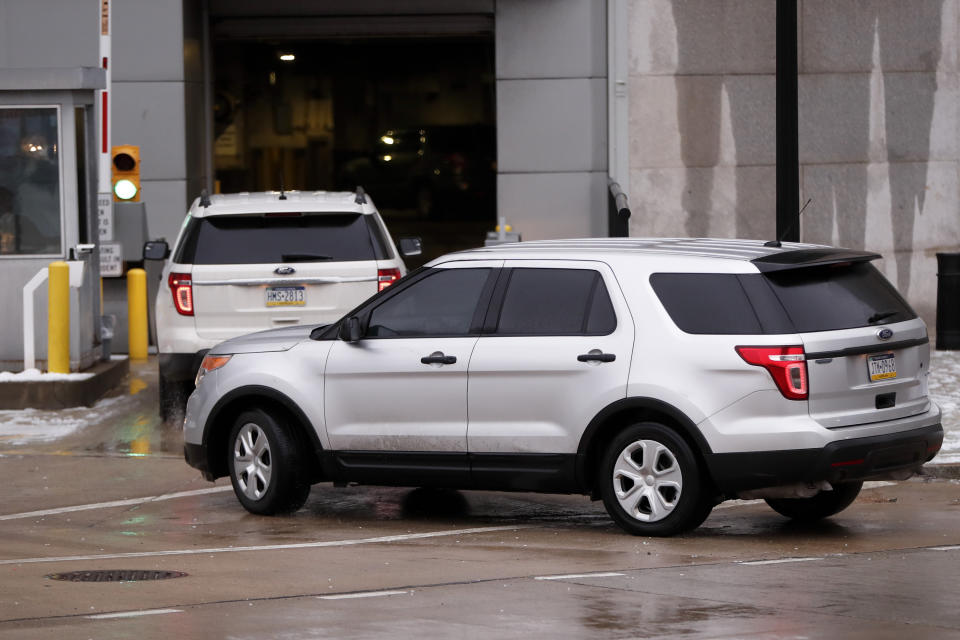 A motorcade of official vehicles arrives at federal court where Robert Bowers is to be arraigned on additional charges, Monday, Feb. 11, 2019, in Pittsburgh. Bowers is accused of killing 11 and wounding seven during an attack on a Pittsburgh synagogue in October of 2018. (AP Photo/Keith Srakocic)