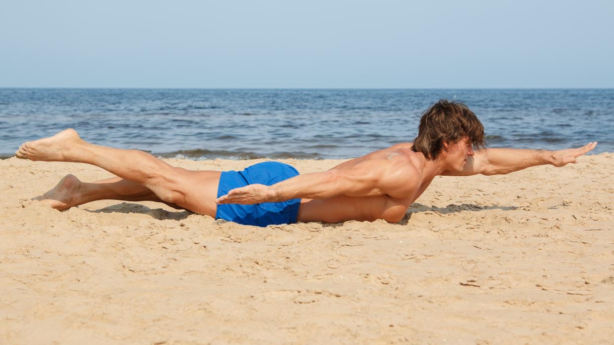  a man doing the swimmers exercise 