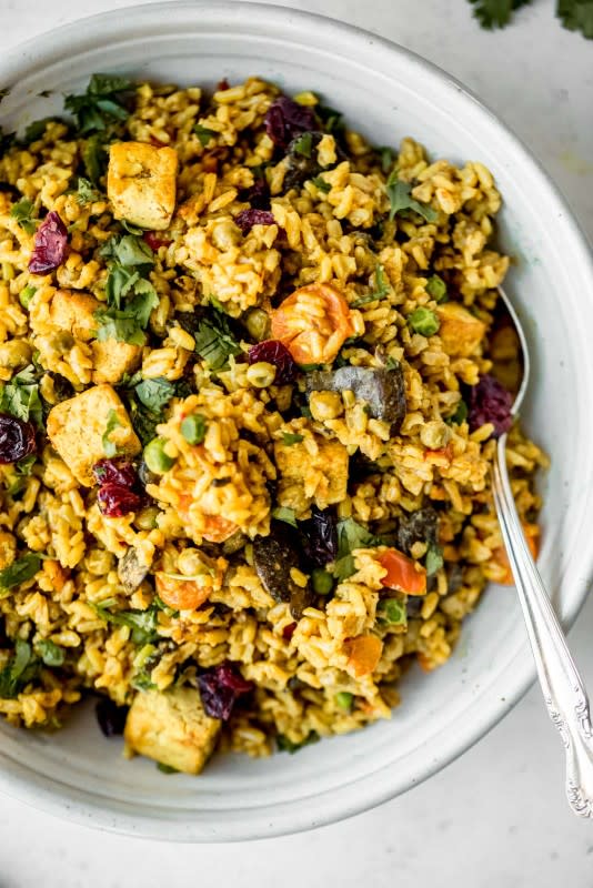 <p>Ambitious Kitchen</p><p>Delicious, savory coconut curried brown rice made with warming spices, crispy tofu, tons of veggies and creamy coconut rice.</p><p><strong>Get the recipe: <a href="https://www.ambitiouskitchen.com/coconut-curried-brown-rice/" rel="nofollow noopener" target="_blank" data-ylk="slk:Coconut Curried Brown Rice;elm:context_link;itc:0;sec:content-canvas" class="link ">Coconut Curried Brown Rice</a></strong></p>