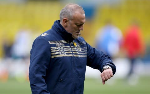 Neil Redfearn checks the time before a Leeds match at Elland Road - Credit: PA