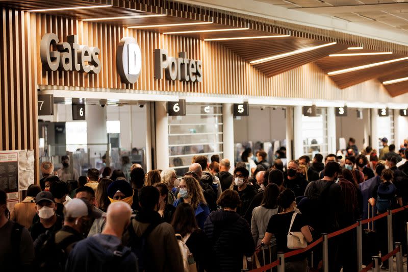 FILE PHOTO: Travellers crowd the departures lounge at Toronto Pearson International Airport in Mississauga