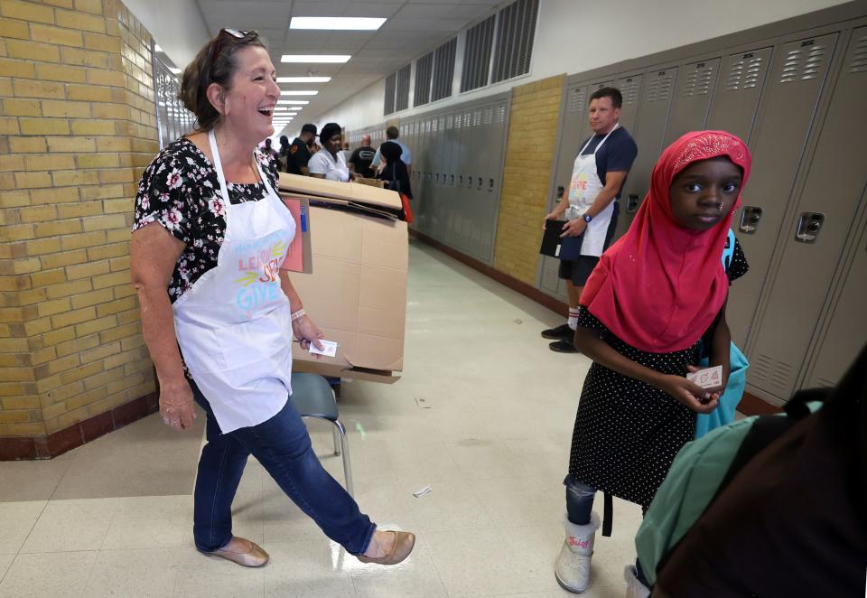 Deseret News writer Holly Richardson volunteers during Refugee Back to School Night at Granite Park Junior High in South Salt Lake on Monday, Aug. 7, 2023. | Kristin Murphy, Deseret News